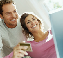 image of couple using credit card